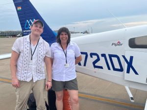 Jaxon and Sandrine in front of N721DX